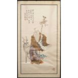 A CHINESE EMBROIDERY ON SILK LATE QING DYNASTYDepicting Shoulao holding a gnarled staff with a