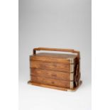 λ A CHINESE HUANGHUALI THREE-TIERED PICNIC BOX AND COVER17TH/18TH CENTURYThe rectangular wood box