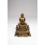A JAIN BRASS FIGURE OF A JINA18TH CENTURY OR EARLIERHe sits high on a throne of interlinked cobras