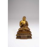A TIBETAN BRONZE FIGURE OF A LUOHAN18TH/19TH CENTURYThe monk seated in dhyanasana with his right