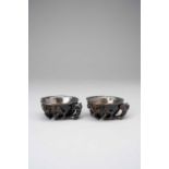 A PAIR OF CHINESE ZITAN 'MAGNOLIA' CUPS18TH CENTURYCarved as large flowerheads supported by a