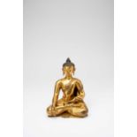 A TIBETAN GILT-BRONZE FIGURE OF BUDDHA SHAKYAMUNIPROBABLY 16TH CENTURYDepicted seated in dhyanasana,