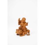 † †A GOOD CHINESE BOXWOOD CARVING OF LIU HAI RIDING HIS TOADQING DYNASTYThe God of Wealth depicted