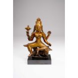 AN INDIAN COPPER-ALLOY SEATED FIGURE OF SHIVAPROBABLY 16TH/17TH CENTURYSeated in lalitasana on a