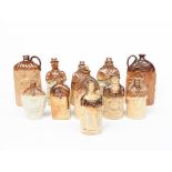 A Steven Green Lambeth salt glaze stoneware Mr & Mrs Caudle flask, modelled in relief, a Woods,