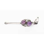 A silver and pink tourmaline bar brooch in the manner of Dorrie Nossiter, wirework tendril