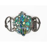 A large silver and enamel belt-buckle probably Scottish, sinuous, wirework frame with blue and green