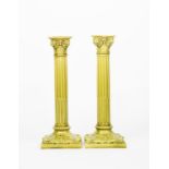 A pair of tall Burmantoft's Faience candlesticks, model no.1850, modelled as Corinthian pillars, the