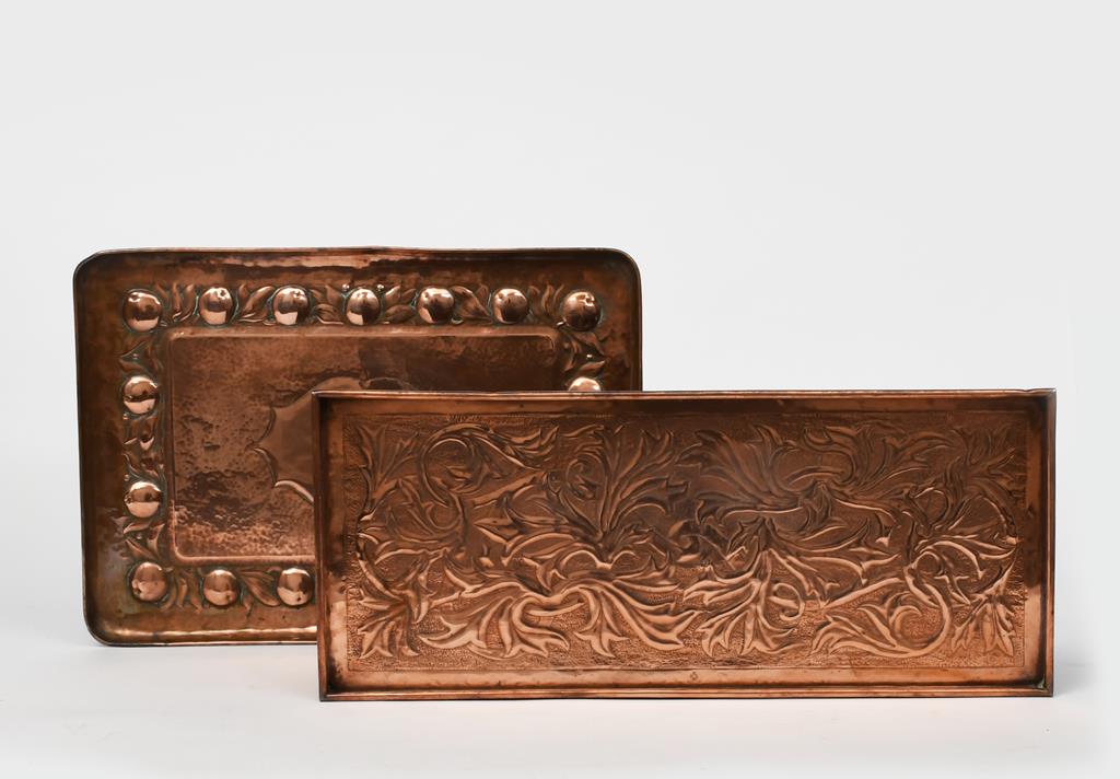 A Keswick School of Industrial Arts copper tray, rectangular with raised rim, scrolling foliage,