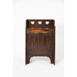 A Liberty & Co oak coal cupboard, tapering, rectangular section, with cut-out heart decoration,