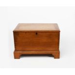 A Heal's small oak coffer, rectangular with hinged cover, with fine dove-tail joints, unsigned,
