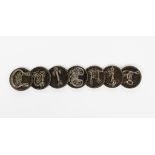 A Celtic bog oak and silver Cuibhig remembrance bracelet, seven circular bog oak panels, each set