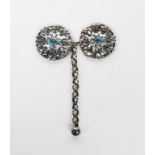 A silver and enamel cloak clasp by Bertha Lillian Goff, two silver flowerhead panels with