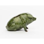 A Ewenny Pottery Pig money bank probably by Horace Elliott, dated 1911, modelled seated on its