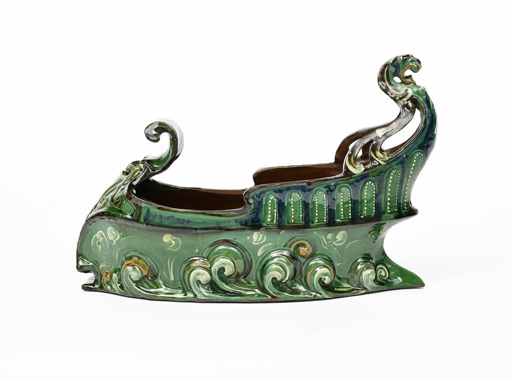 A large C H Brannam Barum Ware pottery boat centrepiece by Reginald Pearce, dated 1903, pierced