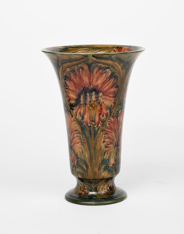 Chrysanthemum/Revived Cornflower a tall James Macintyre footed vase designed by William Moorcroft,