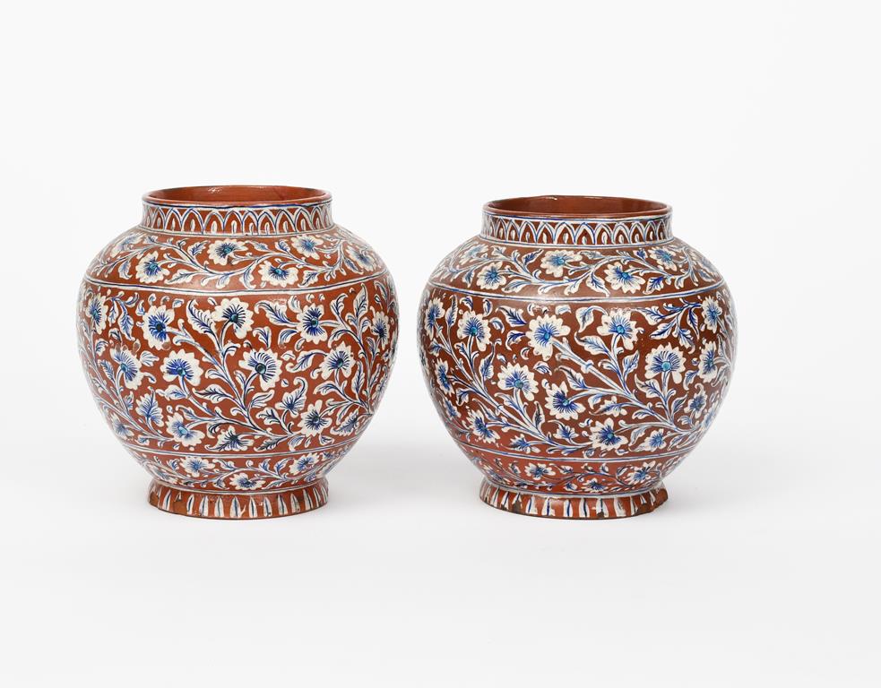 A pair of Bombay School of Art Wonderland Pottery vases, ovoid, with collar rim, painted with