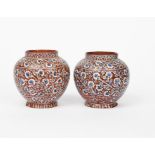 A pair of Bombay School of Art Wonderland Pottery vases, ovoid, with collar rim, painted with