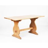 A Heal's limed oak table, rectangular top with lyre shaped legs, peg joints, applied ivorine