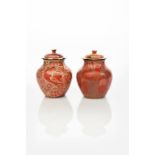 A pair of William De Morgan pottery covered vases, shouldered form with shallow domed covers,