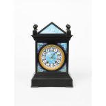 An Aesthetic Movement polished slate mantel clock designed by Lewis F Day, rectangular section, with