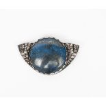 A silver and Lapis brooch by H G Murphy, shaped, open work form with simple flowers and foliage, set