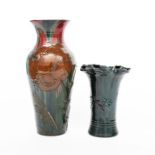 A Sunflower Pottery vase by Sir Edmund Elton, cylindrical form with flaring fluted rim, applied with