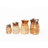 Four graduated salt glaze stoneware Duke of Wellington jugs, unsigned, damages, 21cm. high (