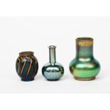 An Art Nouveau miniature vase in the manner of Zsolnay Pecs, shouldered, dimpled cylindrical form,