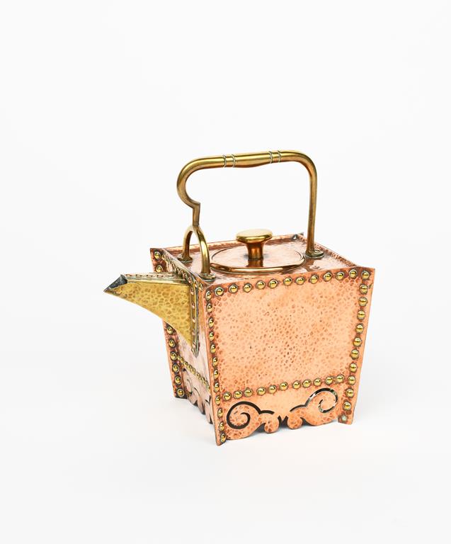 A Benham & Froud copper and brass tea kettle and cover designed by Dr Christopher Dresser, flaring
