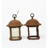 A pair of Faraday and Sons metal hall lanterns, iron frame with domed top, one with cylindrical