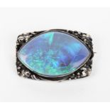 A Rhoda Wager silver mounted opal brooch, the rectangular frame with leaf and berry design, with