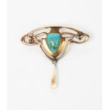 An Art Nouveau Henry Matthews gold brooch, pierced entrelac frame set with turquoise cabochon,