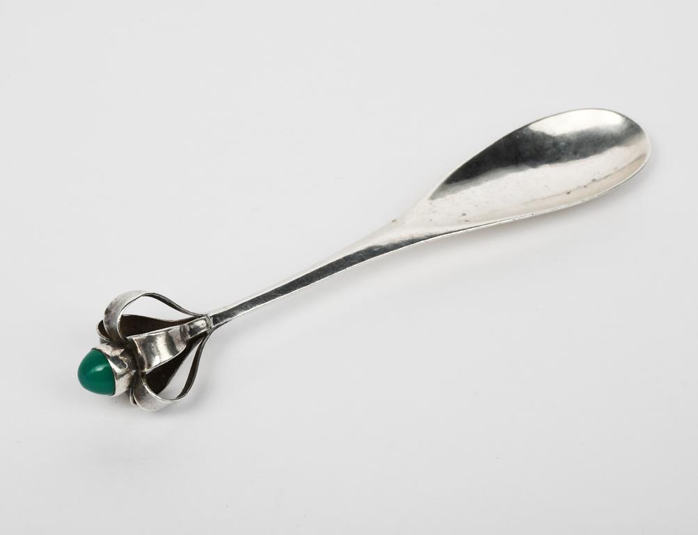 A Guild of Handicraft Ltd silver spoon designed by Charles Robert Ashbee, with openwork terminal set