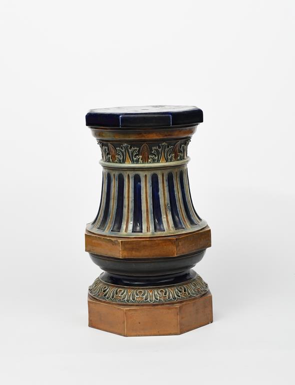 A stoneware jardiniere stand or garden seat probably Doulton, modelled with bands of foliage and