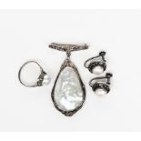 A Rhoda Wager hanging pendant silver brooch, the silver frame with simple leaf and berry decoration,