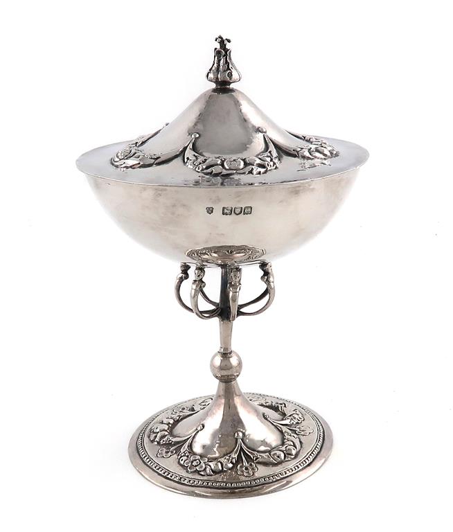 A silver cup and cover designed by C R Ashbee, circular form, knopped stem with seven wire-work