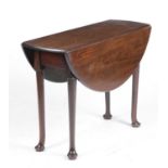 A GEORGE II MAHOGANY DINING TABLE C.1750 the oval drop-leaf top on tapering legs and pad feet 70cm
