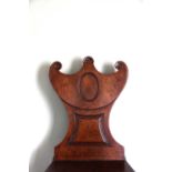 A REGENCY MAHOGANY HALL CHAIR EARLY 19TH CENTURY with a panelled gorget back Provenance The property