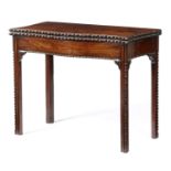 AN EARLY GEORGE III MAHOGANY SERPENTINE TEA TABLE C.1770 with egg and dart carved decoration, the