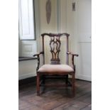 AN EARLY GEORGE III MAHOGANY OPEN ARMCHAIRCHIPPENDALE PERIOD, C.1770 with a pierced curved splat