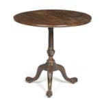 A GEORGE II MAHOGANY TRIPOD TABLE C.1750 the circular tilt-top on a finely carved spiral twist stem,