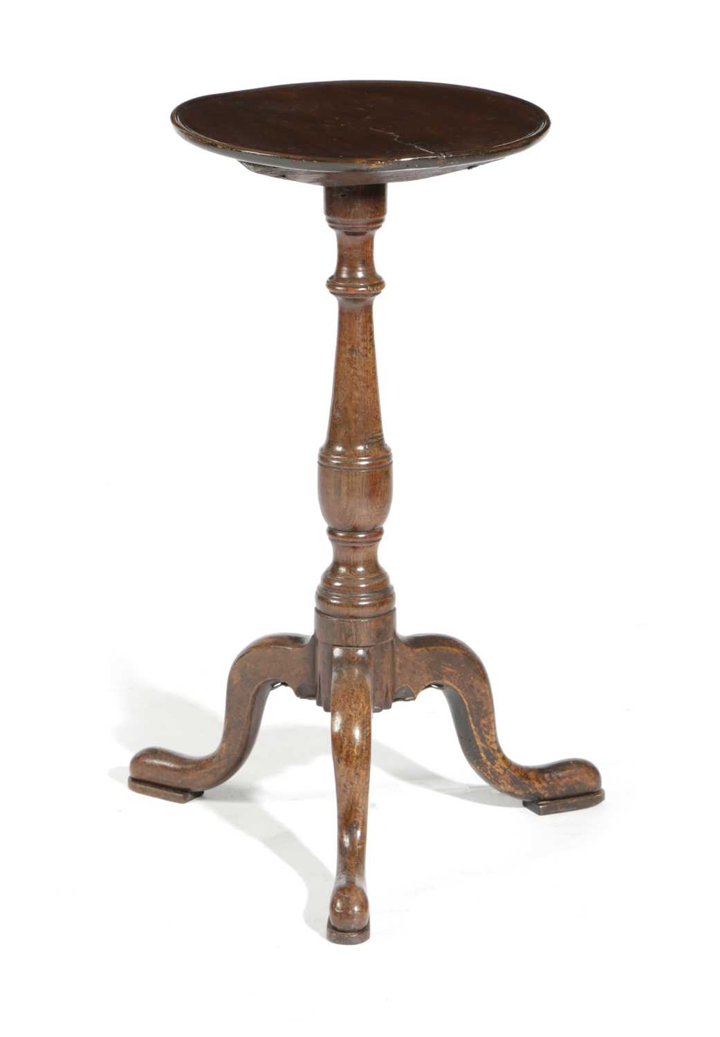 A GEORGE III TRIPOD TABLE C.1770 the circular dished fruitwood top above an oak base 68.5cm high,