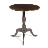A GEORGE III OAK TRIPOD TABLE LATE 18TH CENTURY with a circular tilt-top above a turned baluster