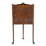 AN EARLY GEORGE III MAHOGANY STANDING CORNER CUPBOARD C.1760 with a tray top above a fielded
