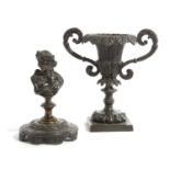 A FRENCH BRONZE BUST OF A CLASSICAL LADY MID-19TH CENTURY on a circular foot, together with a French
