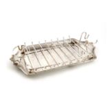 By Asprey London, an electroplated asparagus serving dish,of shaped rectangular form, moulded
