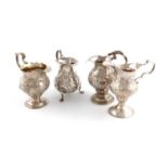 A collection of four George II and George III silver cream jugs, various makers, London 1746,