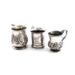 A small collection of three silver mugs,comprising: a George II one, of baluster form, later foliate