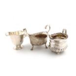 A small collection of three silver jugs,comprising: a George IV one, London 1822, oblong bellied